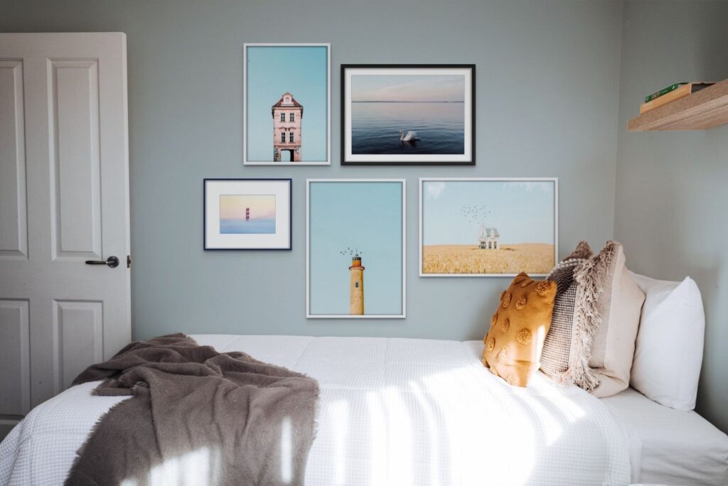 An ArtPlacer Room Mockup. Bedroom in soft, cool colors with a beautiful gallery wall of photographs.