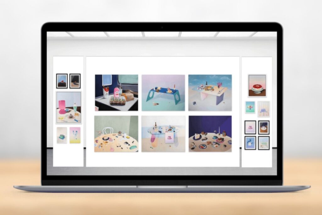 Laptop showing a digital art fair booth layout of colorful still-life paintings planned with ArtPlacer’s Art Show Planner.